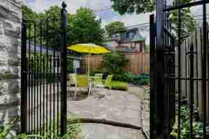 Beautifully landscaped with stone and wrought iron gates.